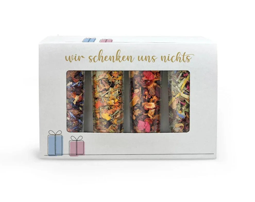 Geschenkbox mit vier bunten Gewürzmischungen, Aufschrift 'wir schenken uns nichts', feinkostgourmet.