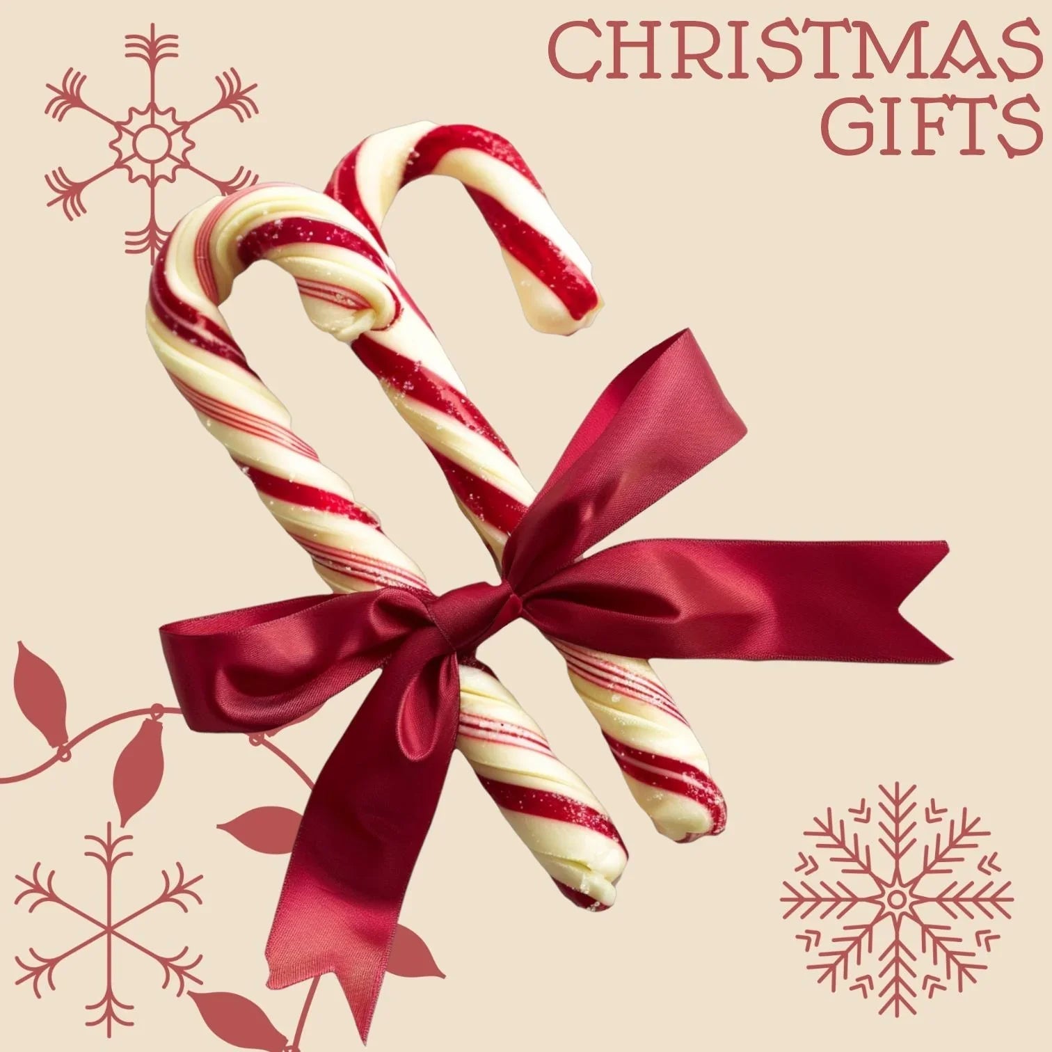 Zwei rot-weiß gestreifte Zuckerstangen mit roter Schleife, Weihnachtsgeschenke, feinkostgourmet