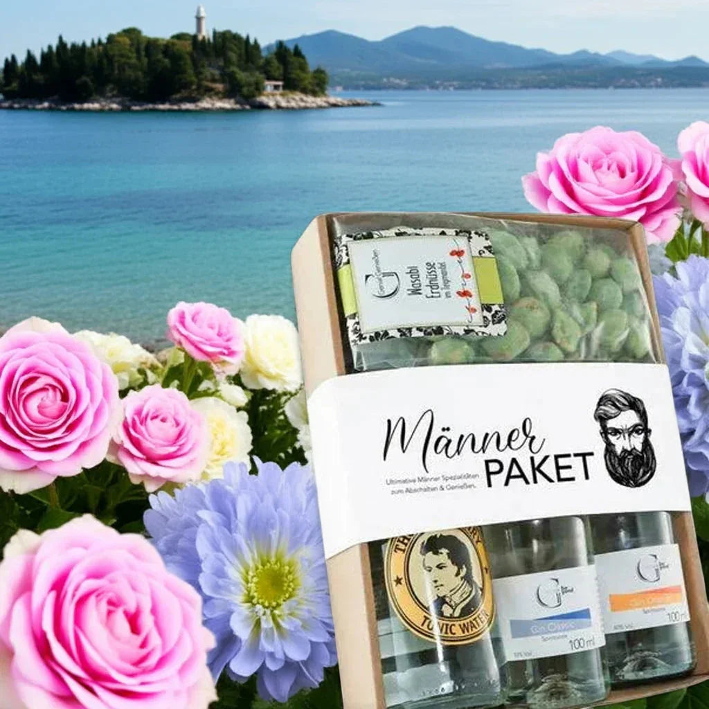 Männer Geschenkpaket mit Feinkost, Dip und Gewürzen von feinkostgourmet vor See und Blumen